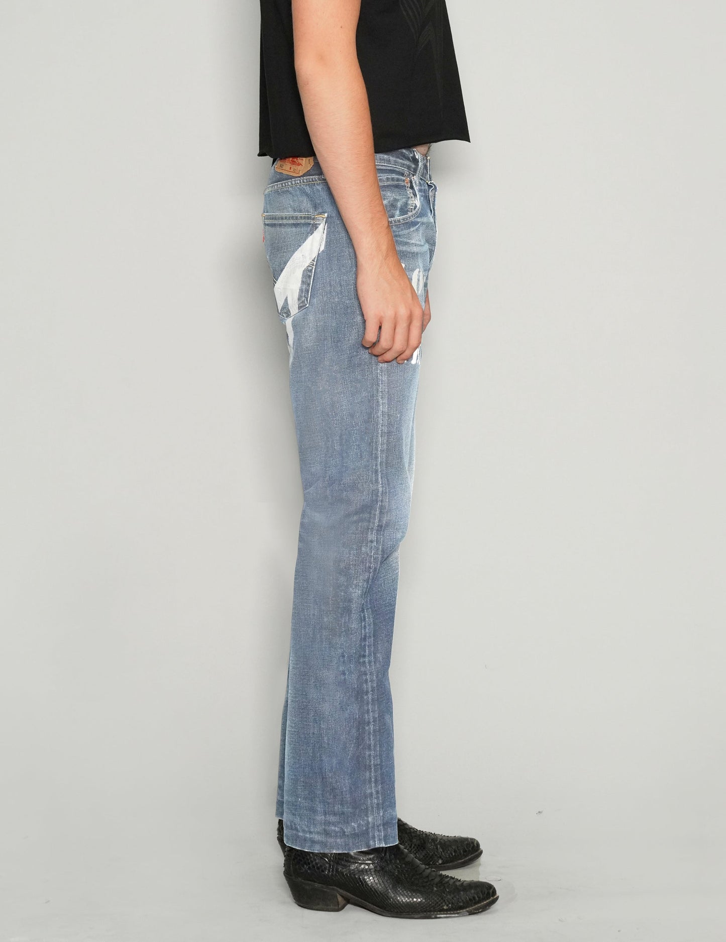 'Love Will Tear Us Apart' Jeans in Light Blue.