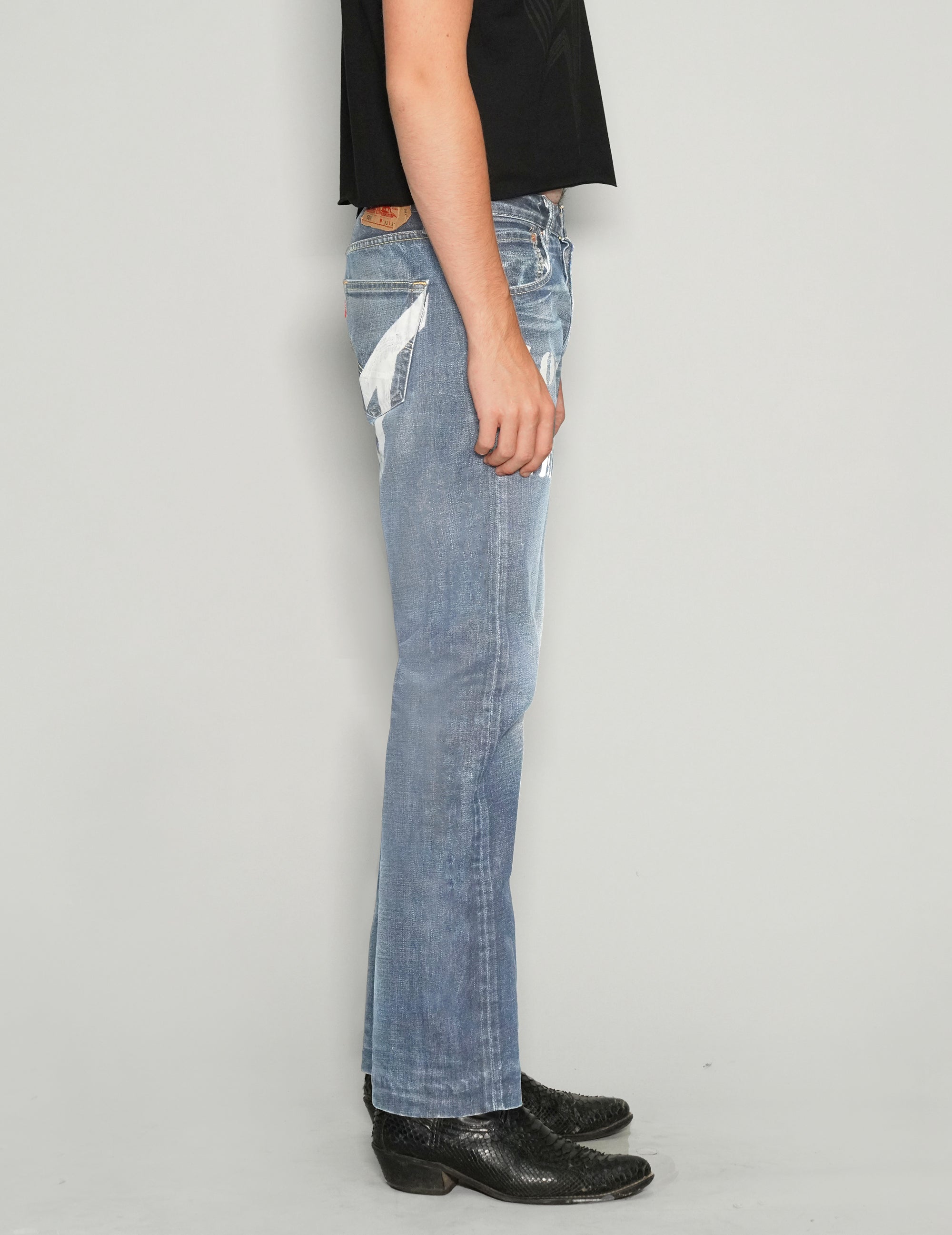 'Love Will Tear Us Apart' Jeans in Light Blue.