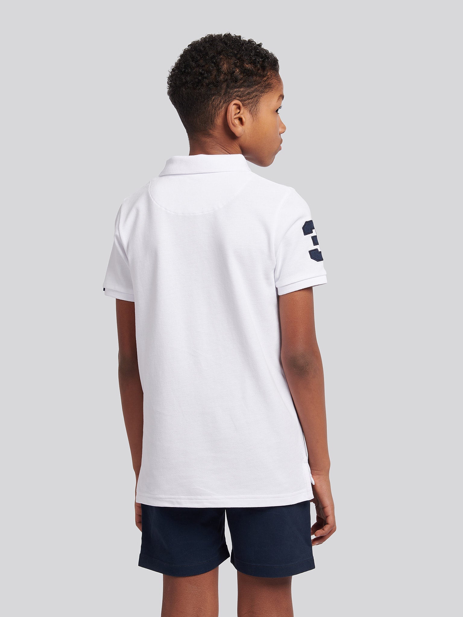 Boys Player 3 Polo Shirt in White / Dark Sapphire Navy DHM